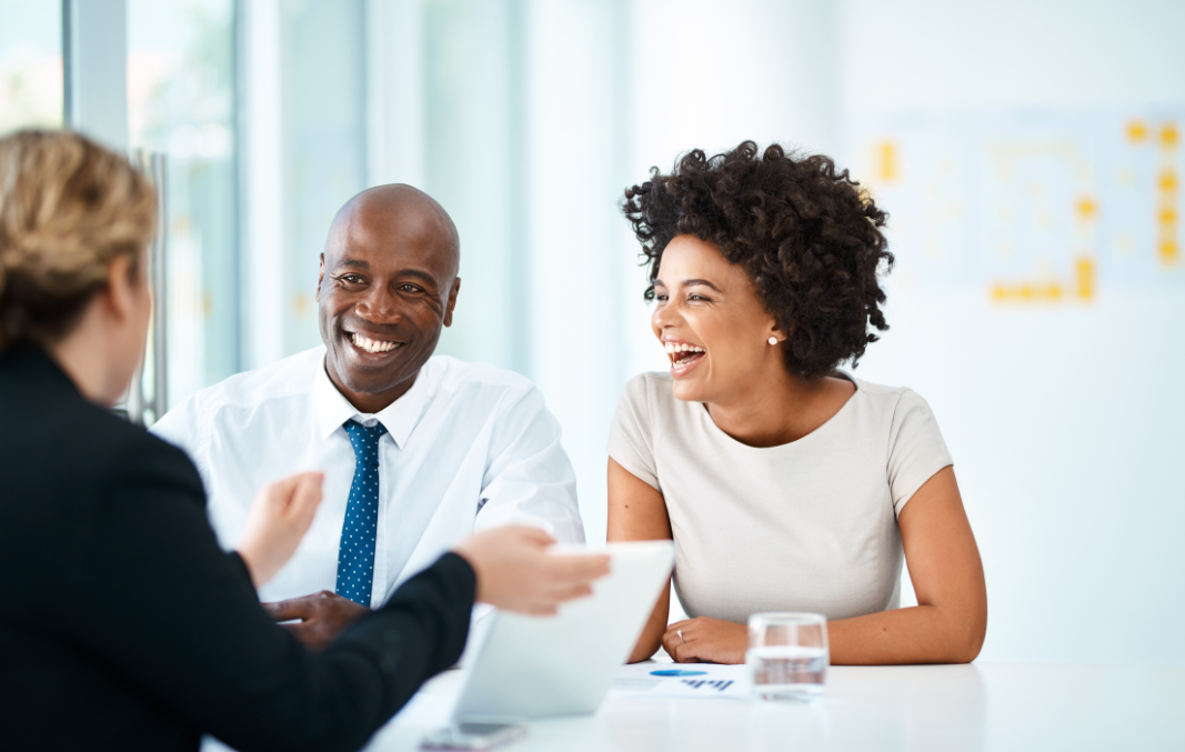 Smiling and laughing team during a meeting